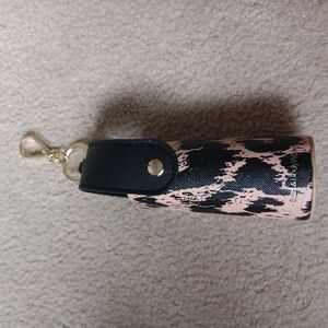 Stylish Black and Tan hand sanitizer holder And small Black Bag.